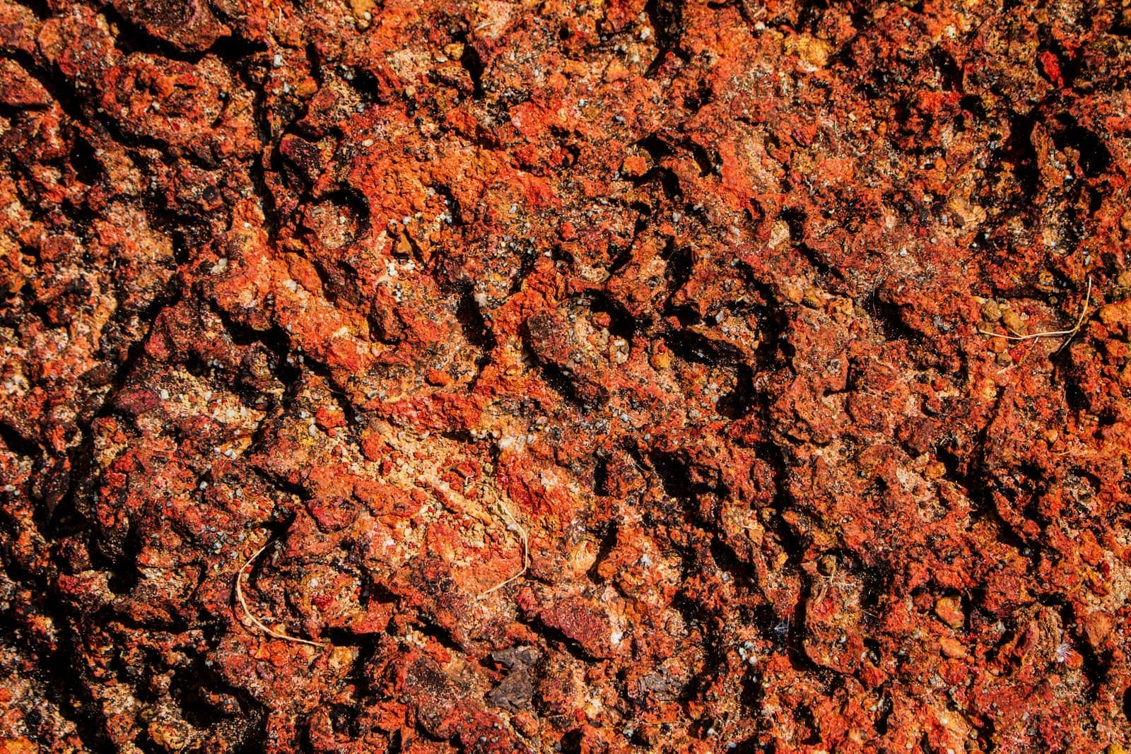Pitted reddish earth-stone, like Kerala laterite (Reference image, not a CHAYP project)
